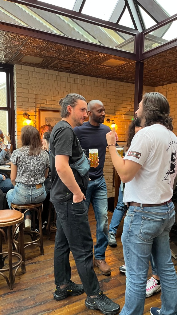 People chatting in a pub.