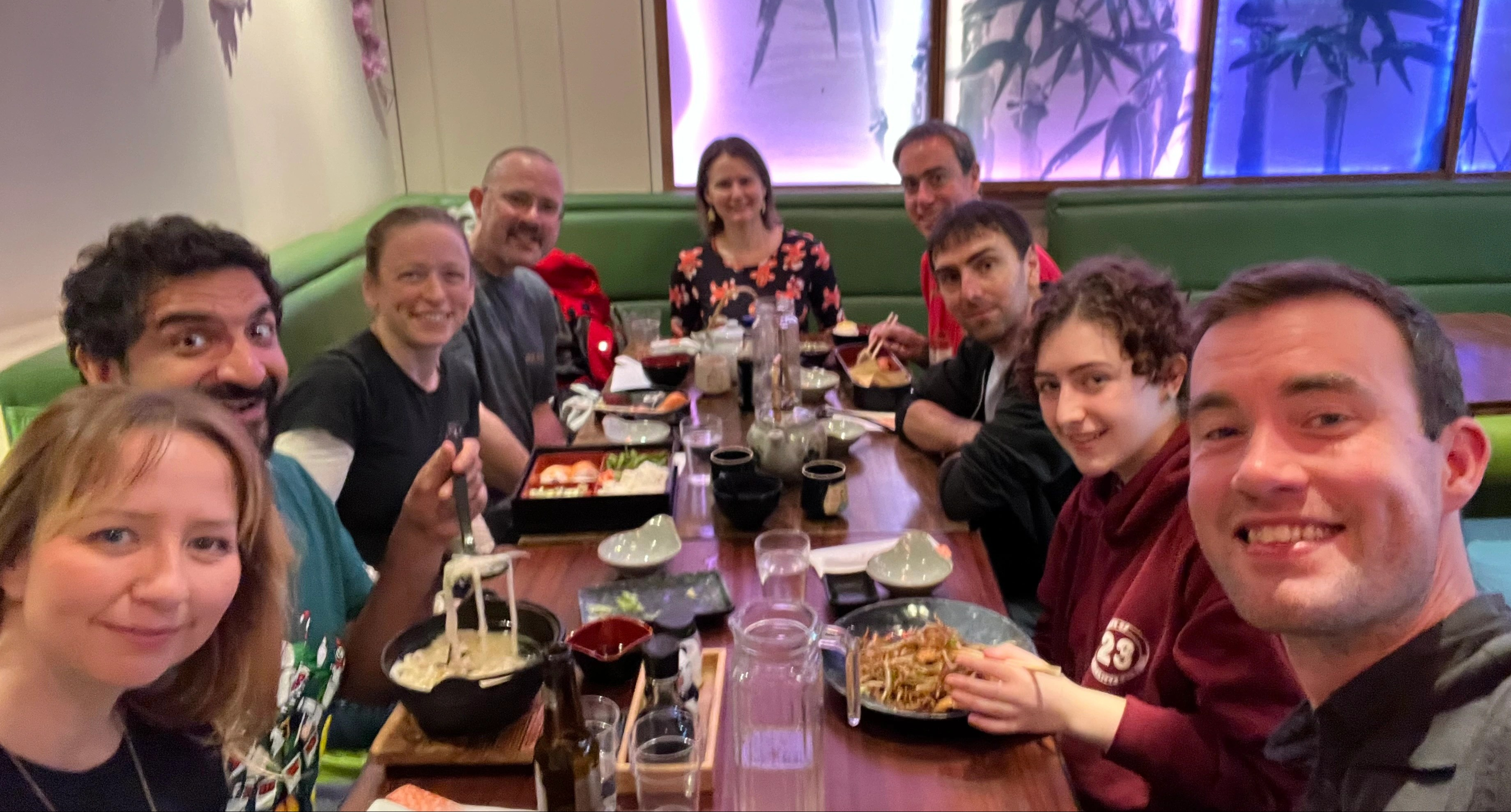 A group of happy people in a Japanese restaurant.